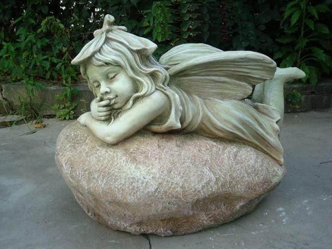 Statue Fairy Laying on Rock